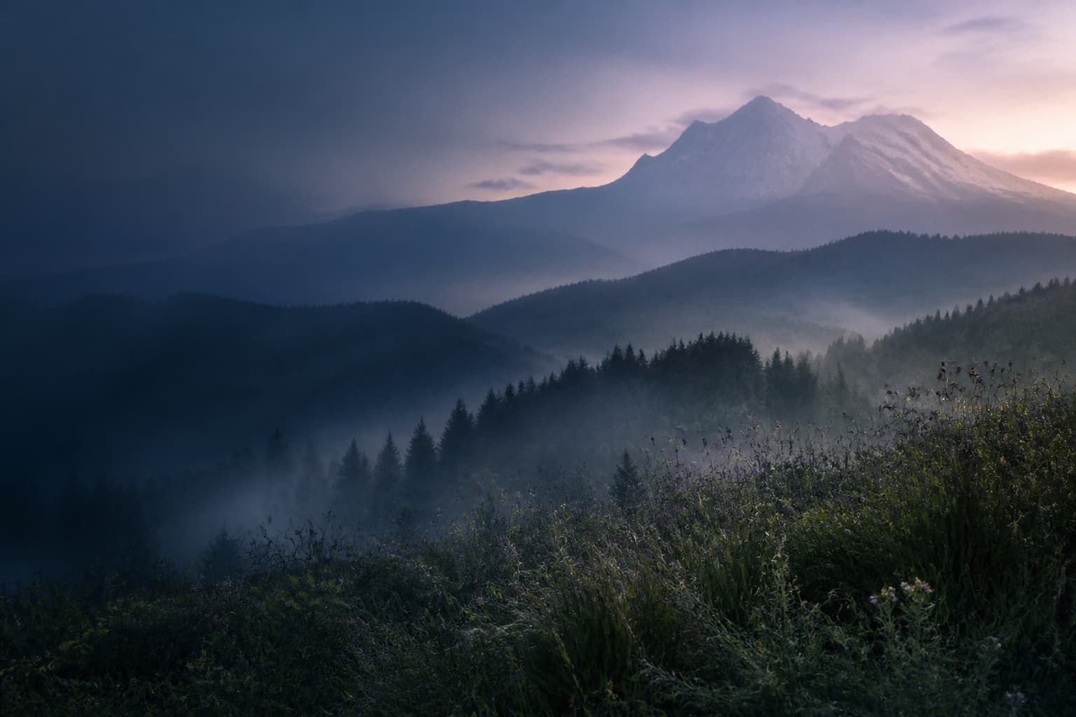 Misty mountain ridges at dawn